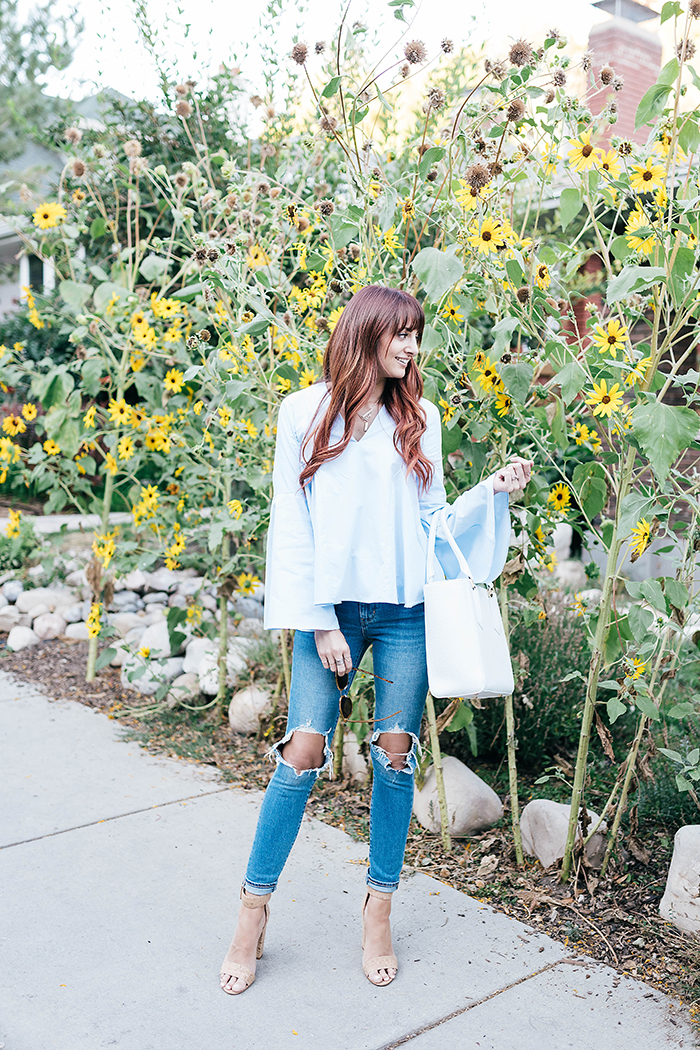 bell sleeve top and shredded jeans Little J Style